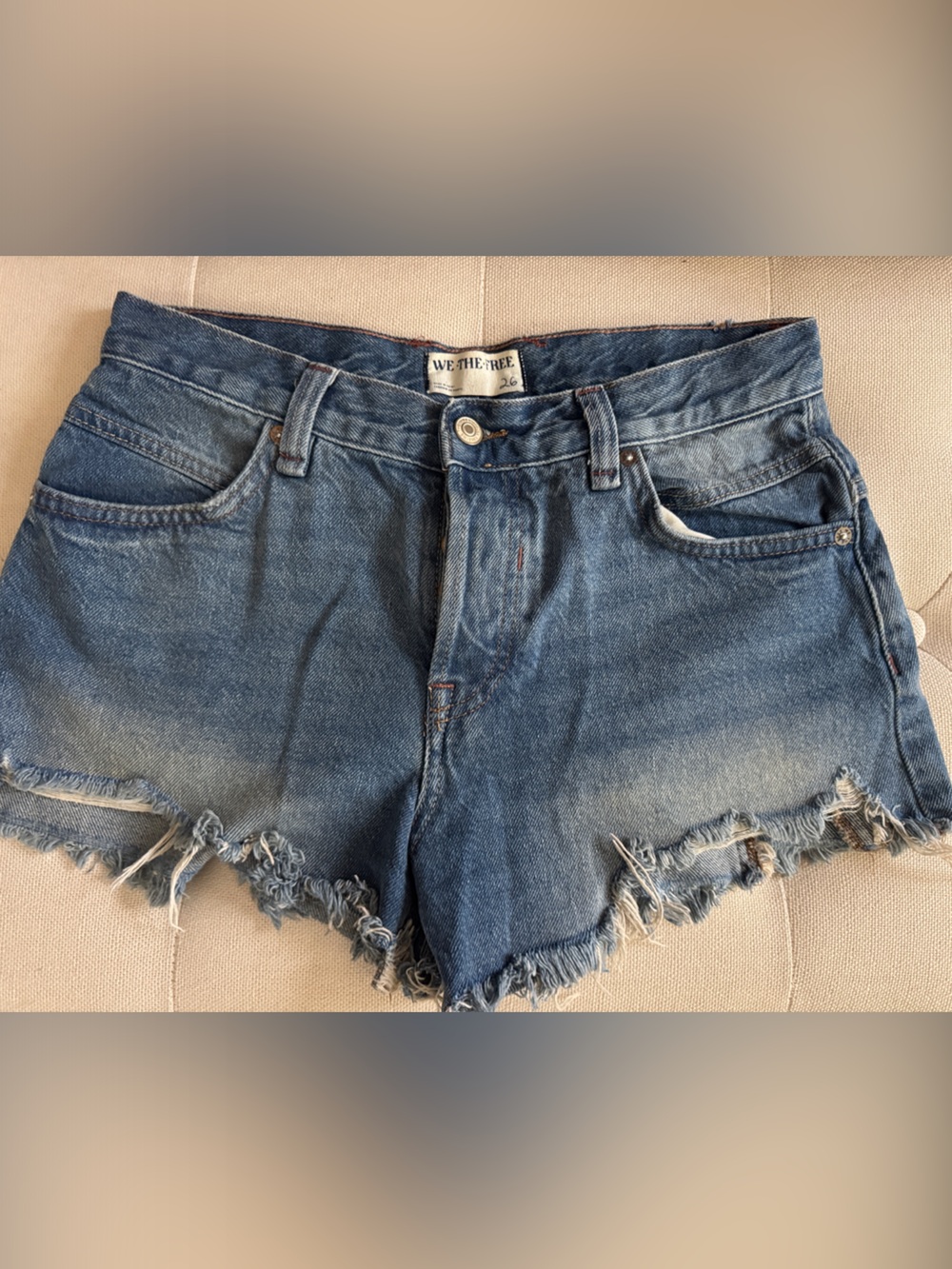 We The Free Distressed High-Rise Denim Cutoff Shorts in Medium Blue